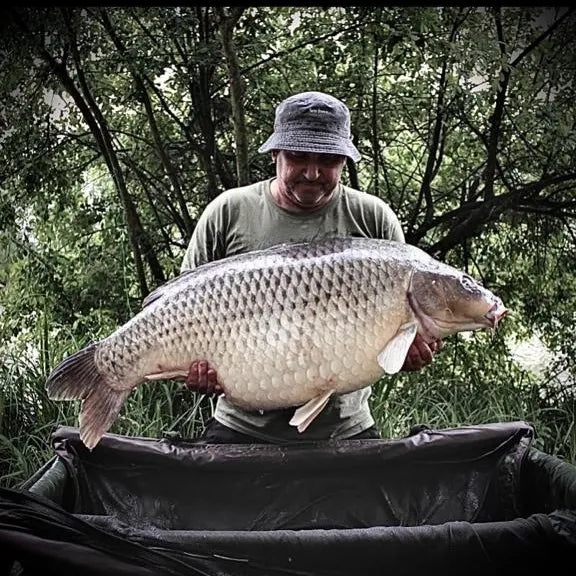 NX Baits sponsored angler Daniel Ormiston proudly displays a large fish caught using NX Baits Scopex Peach range - showcasing the effectiveness of the bait