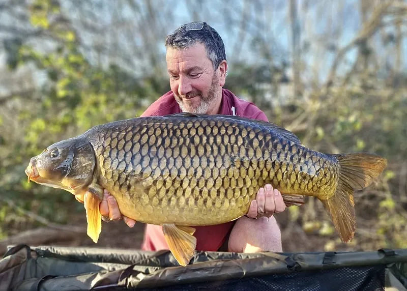 NX Baits sponsored angler Martin Lenaghan proudly displays a large fish caught using NX Baits Scopex Peach range - showcasing the effectiveness of the bait