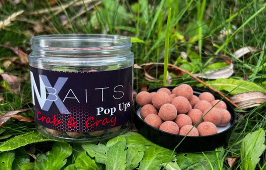 NX Baits Crab & Crayfish Pop Ups - Ultra-buoyant fishing bait in a plastic pot, available in 12mm & 15mm sizes, perfect for attracting carp, tench, and barbel