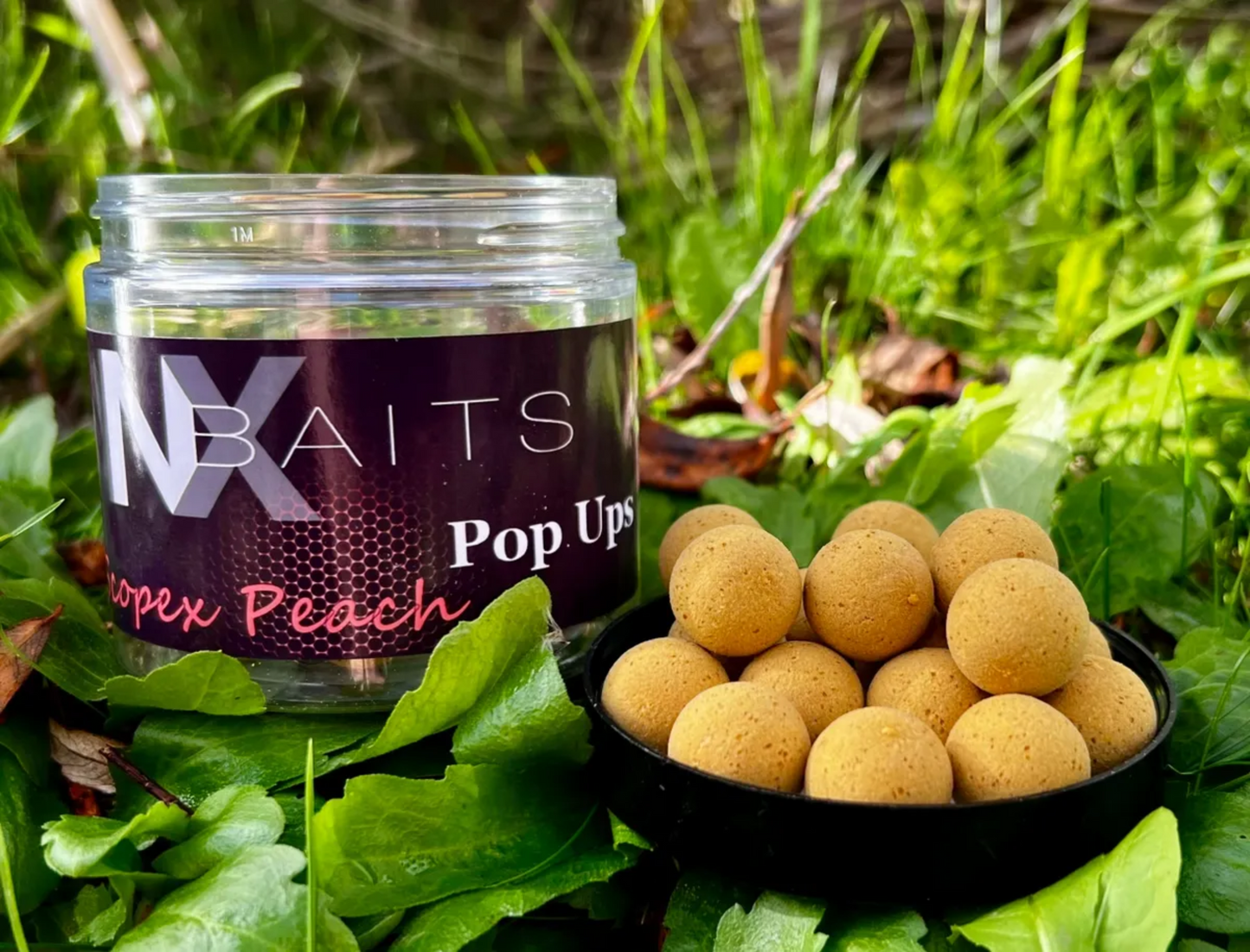 NX Baits Scopex Peach Popups - Ultra-buoyant fishing bait in a plastic tub, available in 12mm & 15mm match-the-hatch sizes, perfect for carp, tench, and barbel fishing