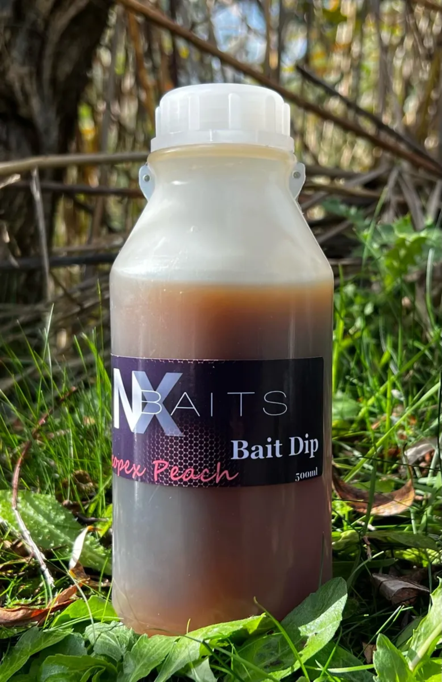 NX Baits Scopex Peach Bait Dip - 500ml bottle, ideal for enhancing fishing baits, PVA friendly and winterized for year-round use.