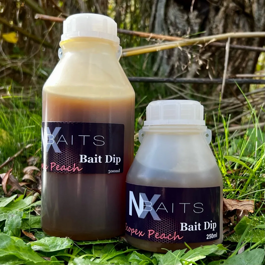 "NX Baits Scopex Peach Bait Dip - Two bottles shown: 500ml and 250ml sizes, ideal for enhancing fishing baits, PVA friendly and winterized for year-round use