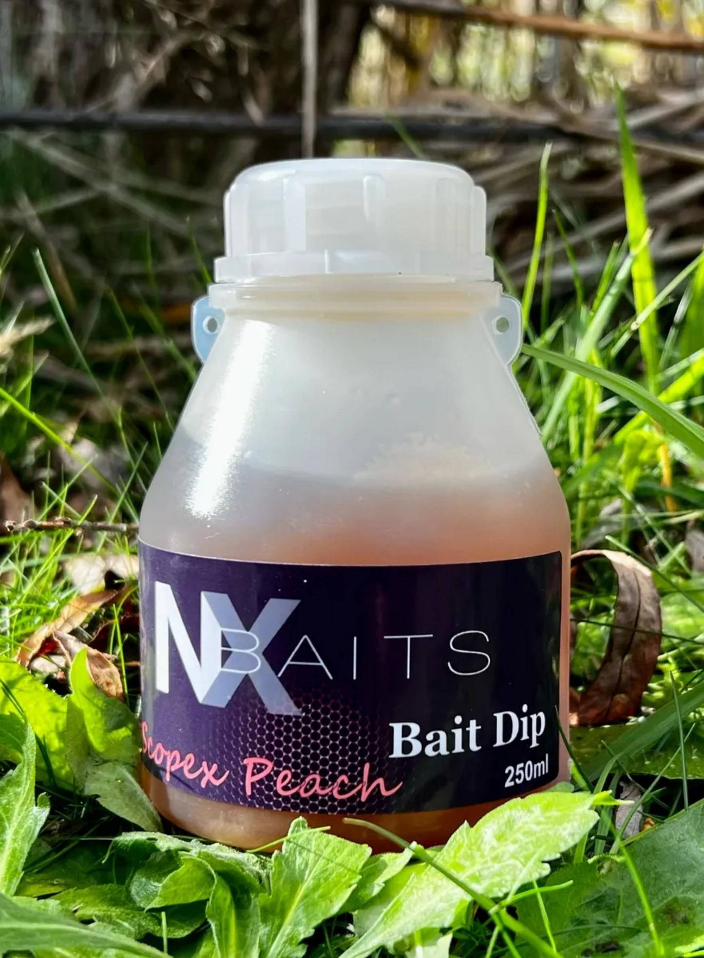 NX Baits Scopex Peach Bait Dip - 250ml bottle, perfect for enhancing fishing baits, PVA friendly and winterized for year-round use